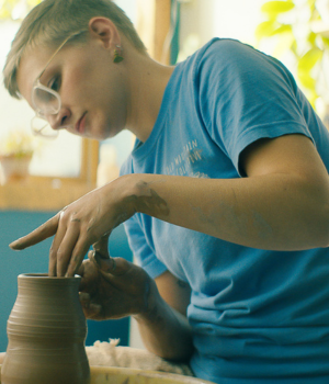 Woman making pottery.