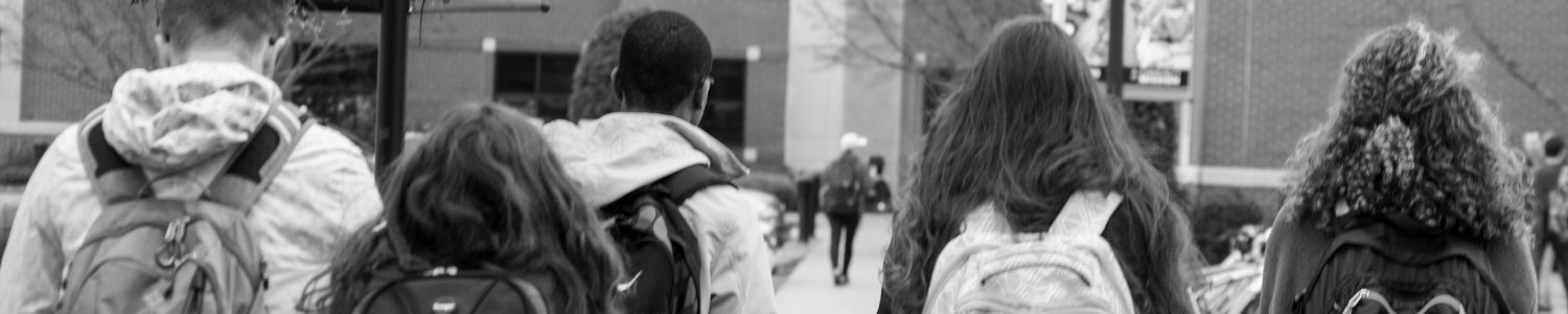 Students with backpacks walking to school 