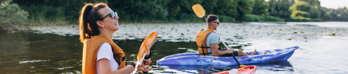 Couple kayaking on the river.